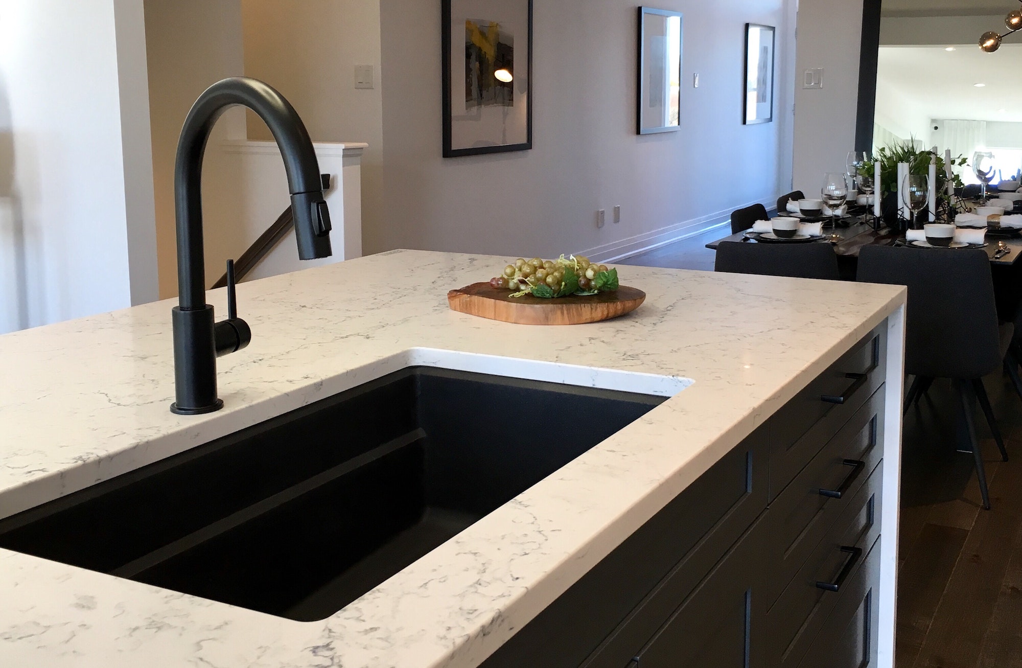 Black kitchen faucet and black recessed sink is trendy and fashionable, stylish interior design